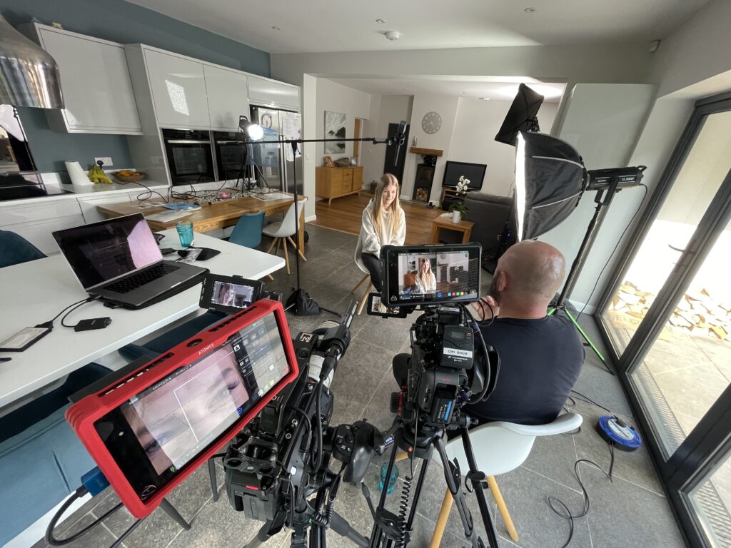 A documentary film crew recording an interview with a young thyroid cancer patient.